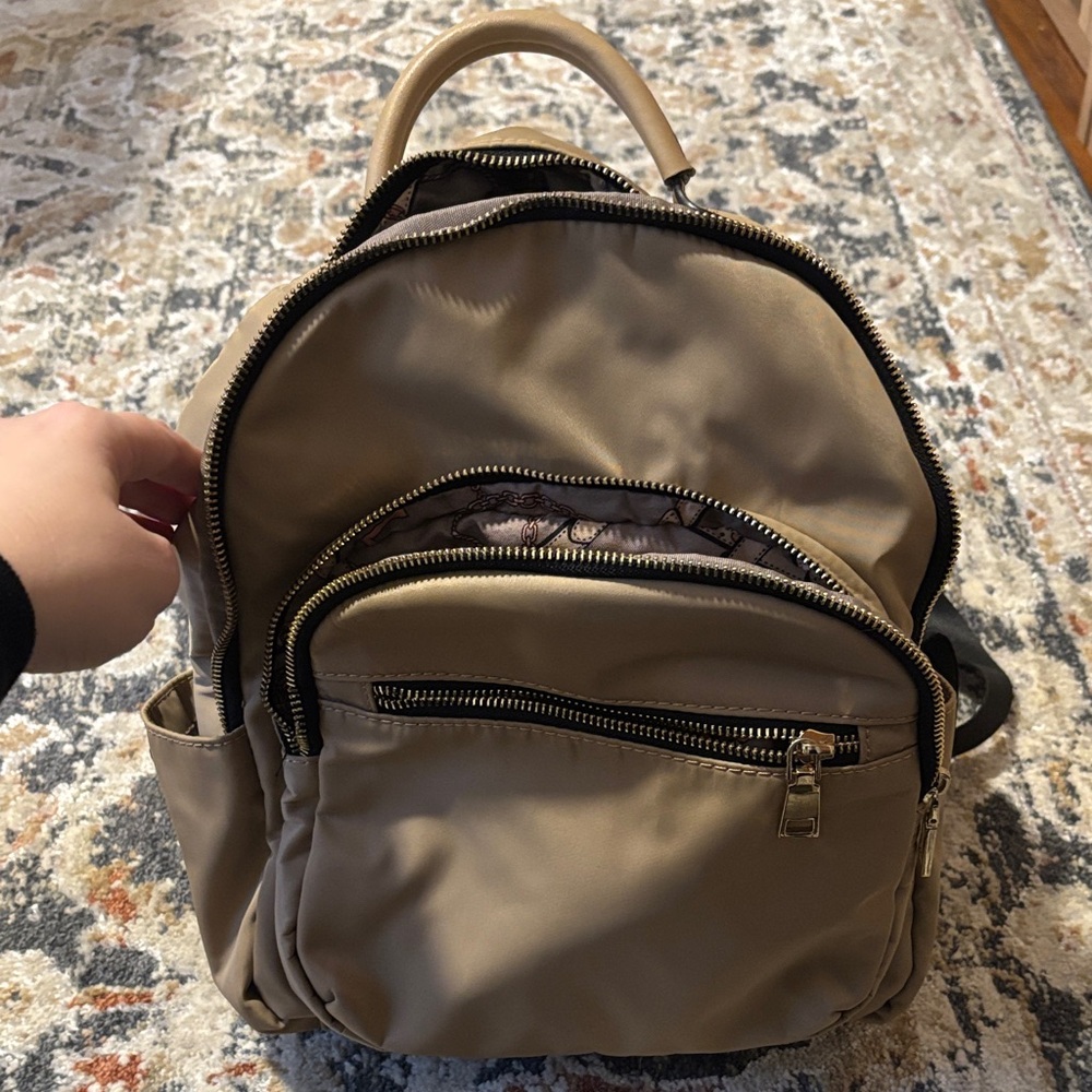 Tan Backpack with Multiple Pockets